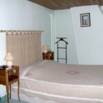 Chambre avec grand lit double et un lit enfant/adolescent